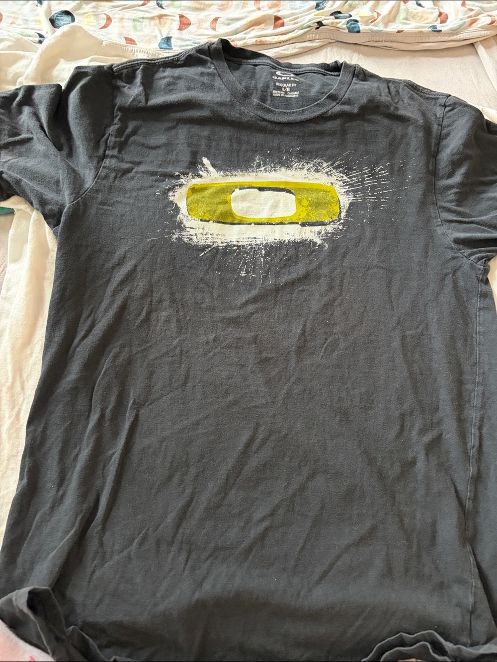 B64 Oakley Men's Black Short Sleeve Tee with Yellow Graphic